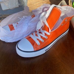 Women’s high top tennis shoes. New/ unworn